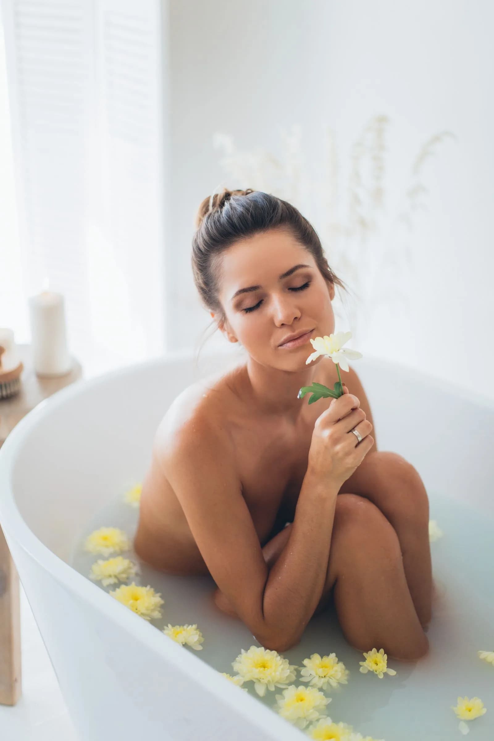 Woman wrapped in a towel resting after a spa hammam ritual