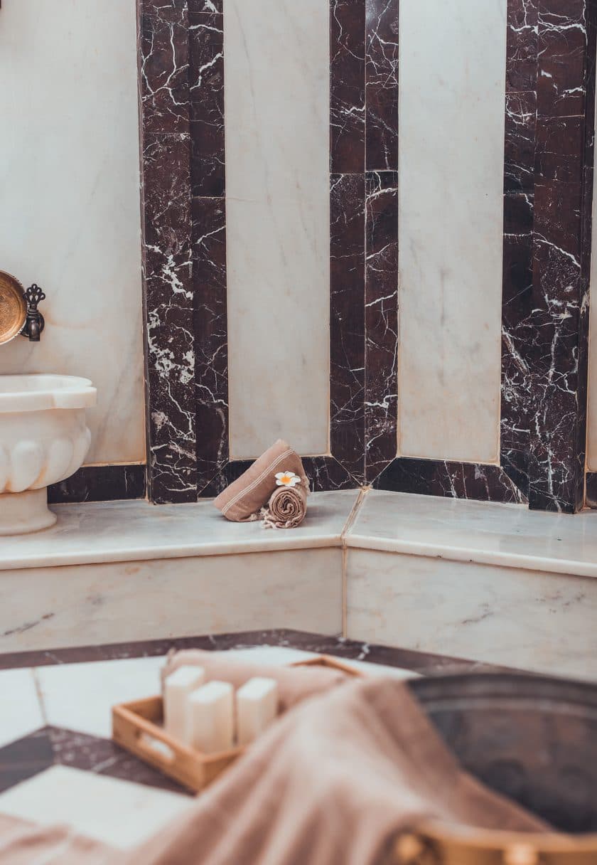 Marble hammam interior with soft towels — gift any spa treatment or package