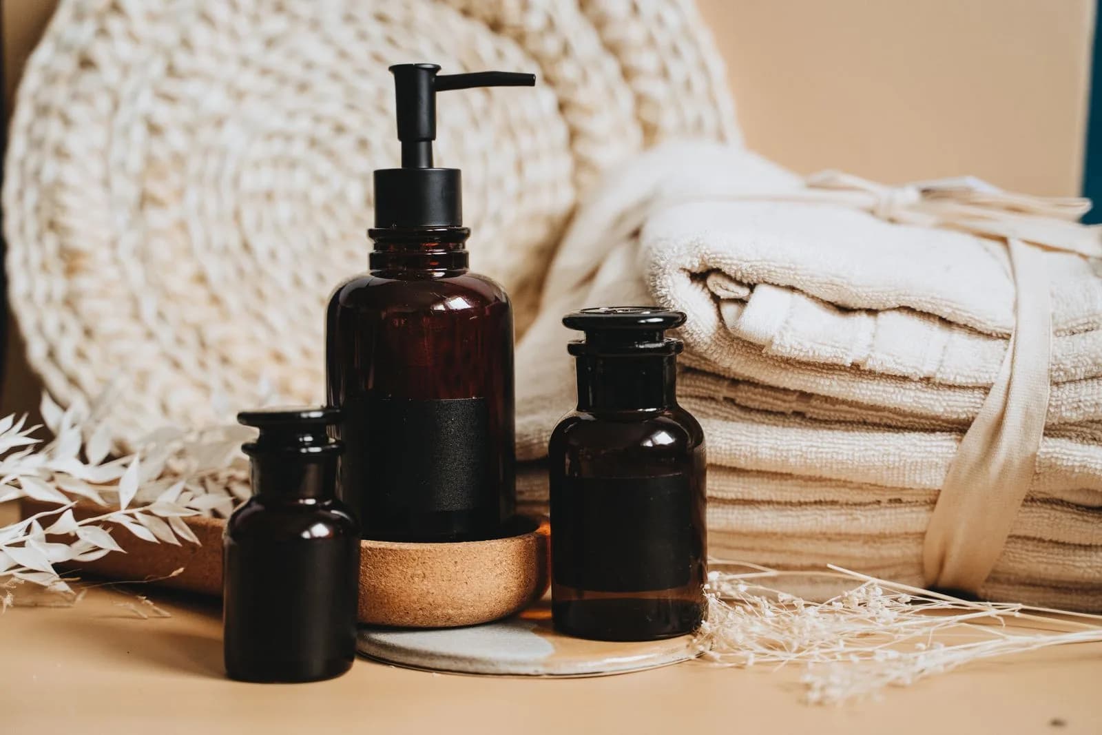 Spa towels, oils and skincare essentials arranged for a spa day in Malta
