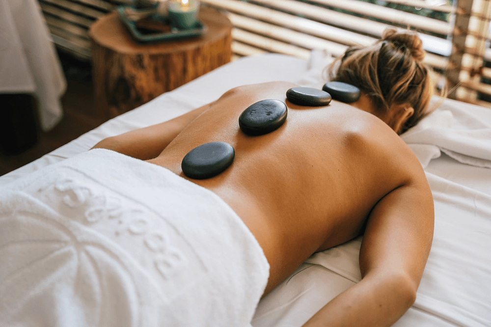 Melt Away Stress With A Hot Stone Massage in Paradise
