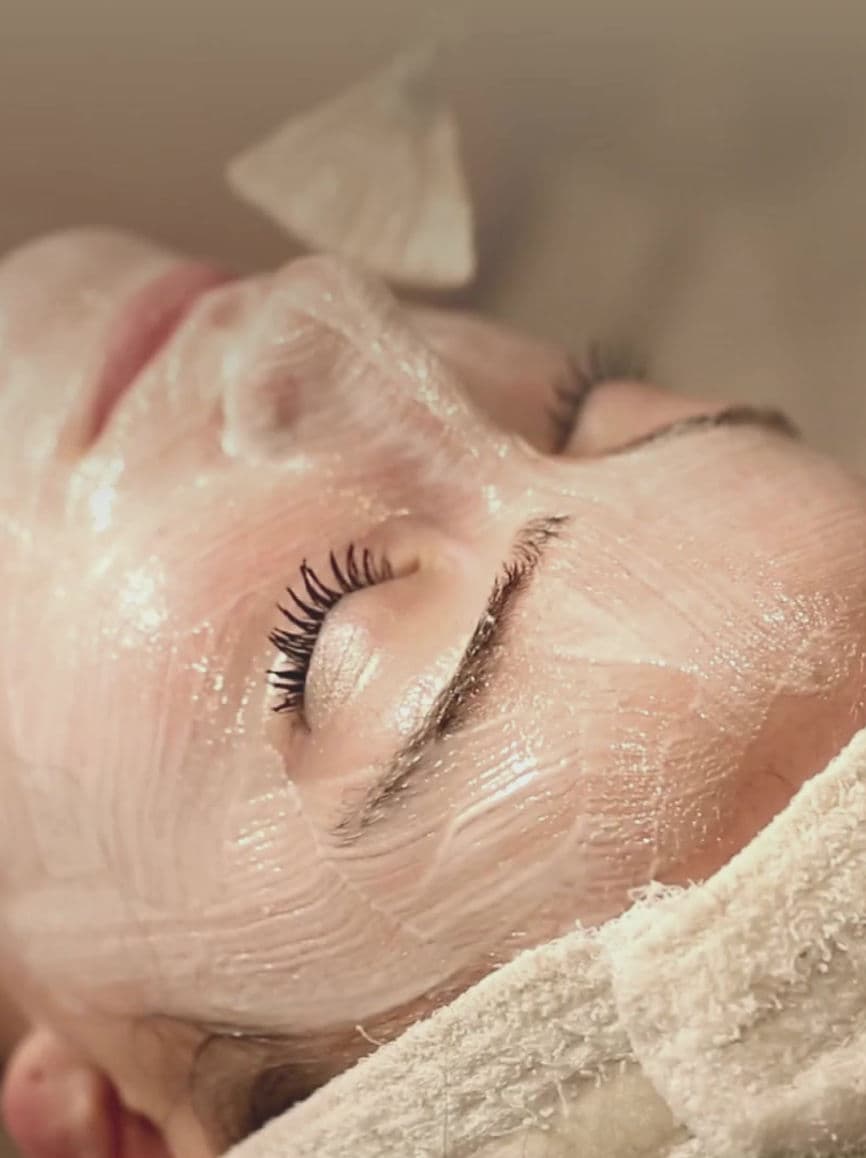 Guest enjoying a professional facial treatment at Carisma Spa in Malta